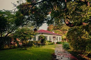 Marangu Hotel in Moshi, image may contain: Hotel, Resort, Grass, Garden