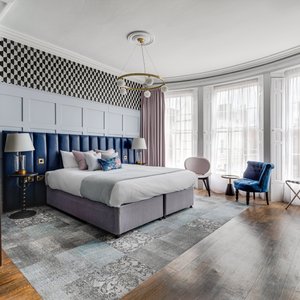 Deluxe King with freestanding bath in bedroom 