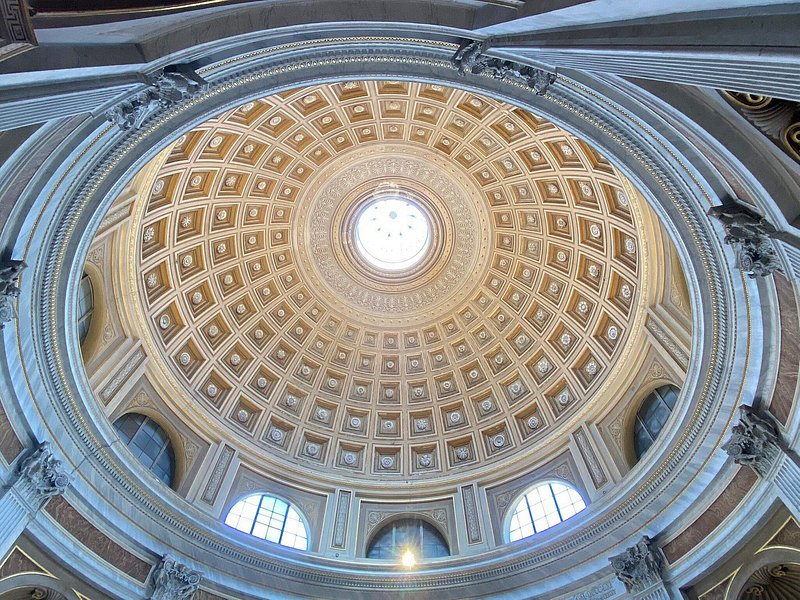 The domed ceiling at Vatican Museums with the sunlight streaming in