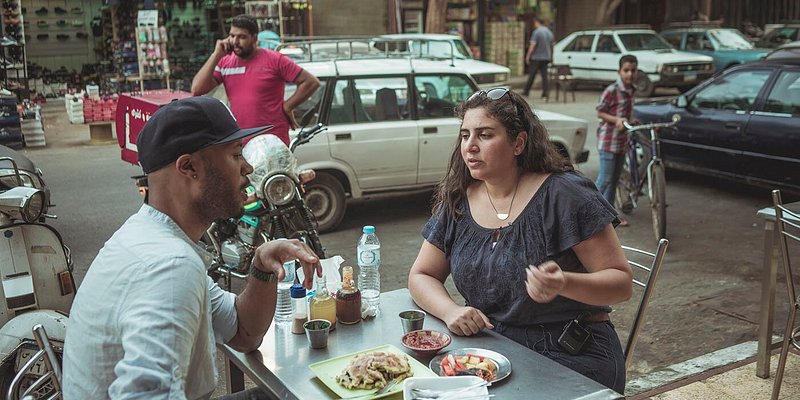 Eric Berry (L) dining with Laila (R) of Bellies En-Route food tours