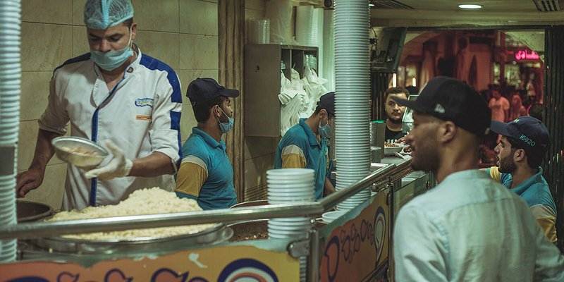 Eric Berry waiting for a vendor to prepare a plate Egyptian Koshari, 