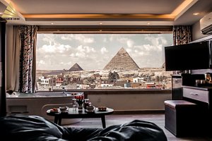 Pyramid Edge Hotel in Giza, image may contain: Living Room, Room, Indoors, Furniture