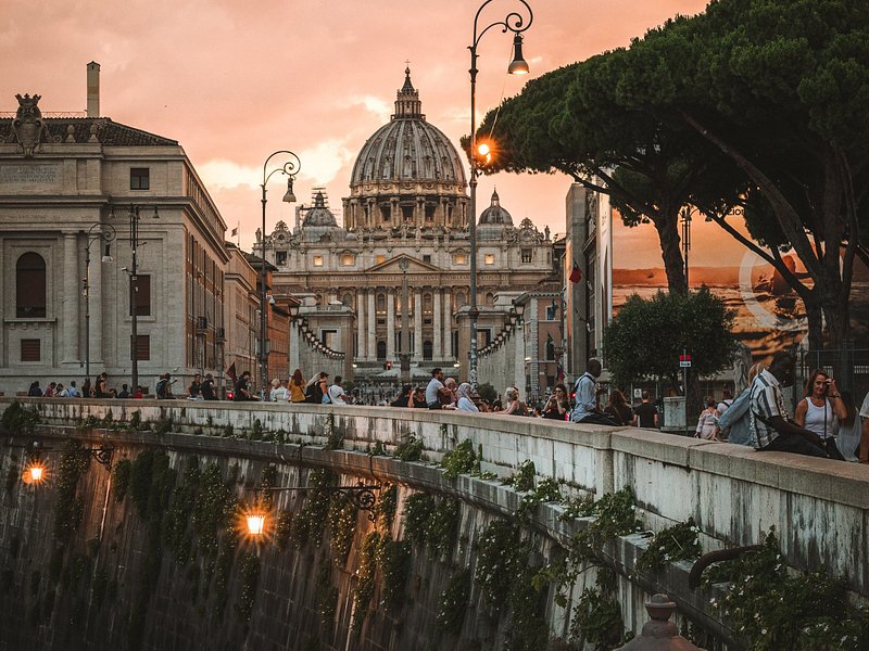 People visiting the Vatican City in Rome in the evening