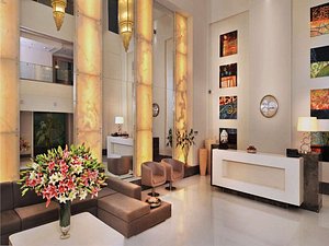 The Ashtan Sarovar Portico in New Delhi, image may contain: Living Room, Home Decor, Flower Arrangement, Foyer