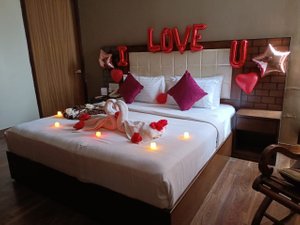 Hotel Suvidha Palace in Una, image may contain: Furniture, Bed, Chair, Cushion