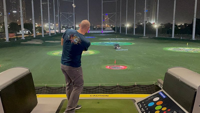 A man playing golf at Topgolf Dubai