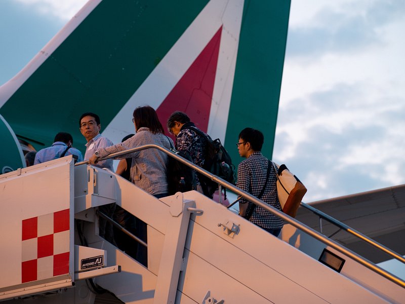 People boarding a plane in Rome