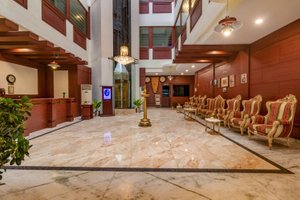 Zip By Spree Hotels Mangala Towers in Thrissur, image may contain: Floor, Flooring, Indoors, Foyer