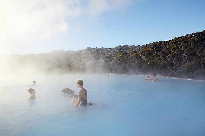 People soaking in a hot spring in Iceland