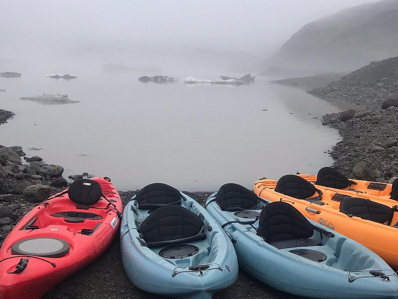 Ready to use kayaks laid on the shore in Iceland