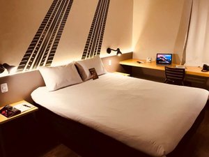 Ibis Styles Tres Rios in Tres Rios, image may contain: Furniture, Bed, Chair, Laptop