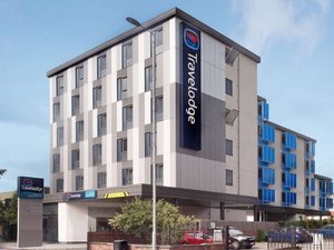 Travelodge Manchester Upper Brook Street in Manchester, image may contain: Office Building, Hotel, City, Condo