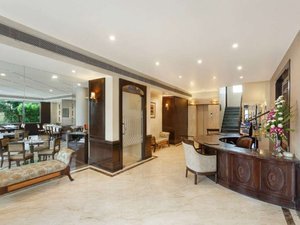 La Place Sarovar Portico, Lucknow in Lucknow, image may contain: Foyer, Indoors, Dining Room, Chair
