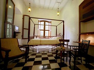 Le Dupleix in Pondicherry, image may contain: Hotel, Resort, Chair, Furniture