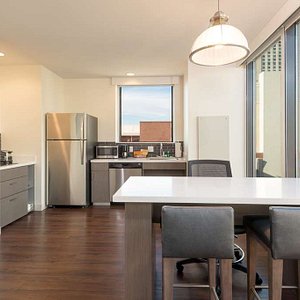 Hyatt House Denver/Downtown in Denver, image may contain: Penthouse, Dining Room, Dining Table, Kitchen