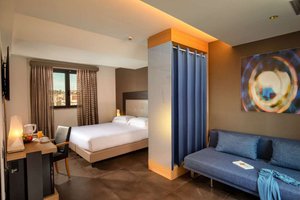Best Western Plus Hotel Spring House Rome in Rome, image may contain: Hotel, Book, Resort, Furniture