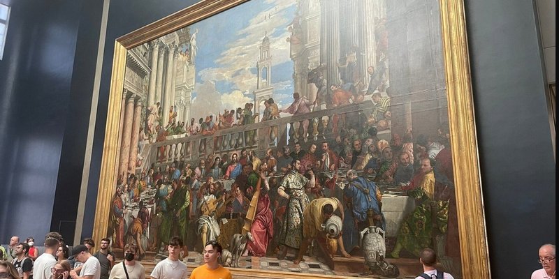 The Wedding at Cana displayed at the Louvre Museum in Paris.