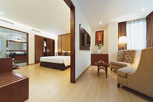Paragon Saigon Hotel in Ho Chi Minh City, image may contain: Flooring, Floor, Living Room, Bed