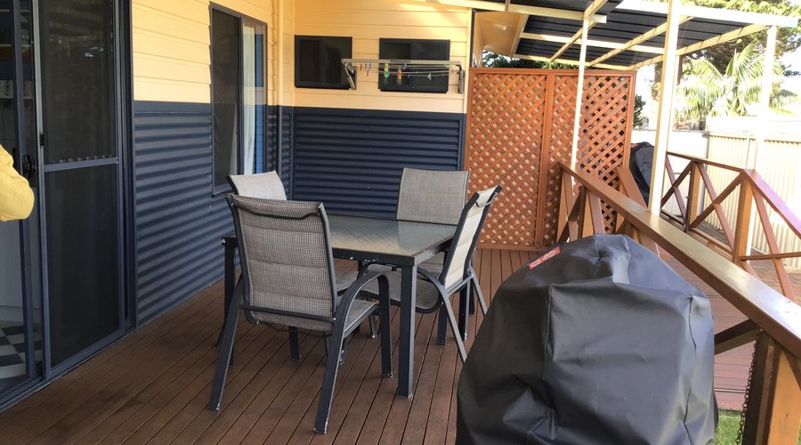 Back patio, complete with bbq, dining, clothes line and ramp. 