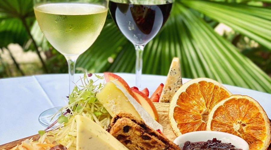 Join us for Wine down Wednesday (Available every Wednesday from 4-6pm.):  Indulge yourselves with a cheese trio platter for two to share, including a glass each of our first pour red or white wines, for $35! 

Sourced locally from Gallo Dairy Land, and served with davidson plum paste, dried fruit bread and lavosh with fresh fruit, enjoy a selection of brie, blue and heritage cheddar.
