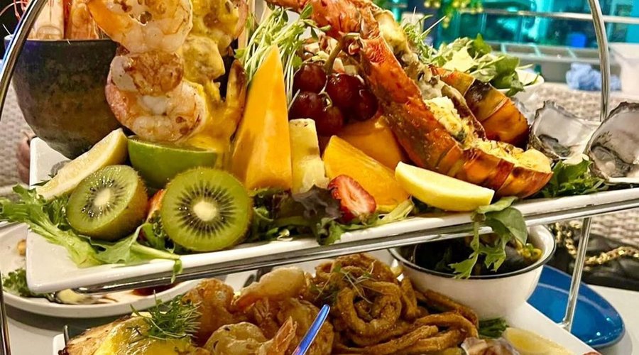 Great Barrier Reef Platter: Chilled bugs, prawns, oysters, oysters kilpatrick, grilled prawns and scallop skewers, mussels in saffron broth, chilli calamari, cider battered prawns, grilled coral trout, rocket and parmesan salad, fresh fruit and dipping sauces