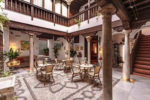 Hotel Casa del Capitel Nazari in Granada, image may contain: Villa, Dining Table, Dining Room, Resort