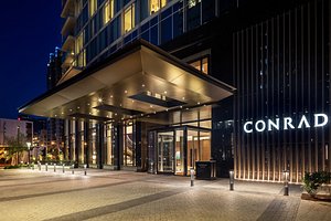 Conrad Nashville in Nashville, image may contain: Lighting, Office Building, Convention Center, City