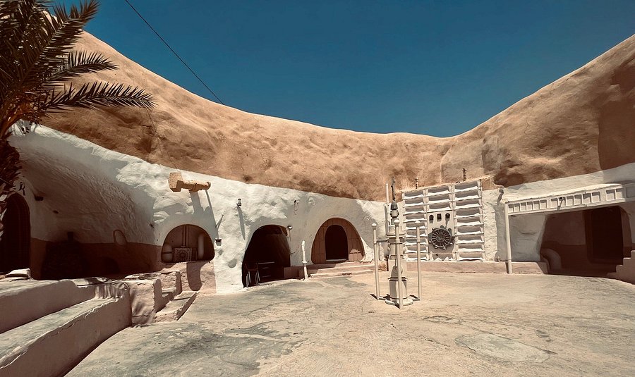 Beautiful view of Hotel Sidi Driss showcasing its unique troglodyte architecture with interconnected courtyards dug into the earth