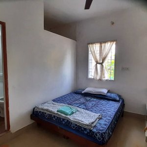 A simple cozy room with attached bathroom.  You also get a living room attached with this.  