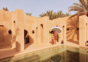 Bab Al Shams Desert Resort and Spa in Dubai, image may contain: Villa, Housing, Person, Hacienda