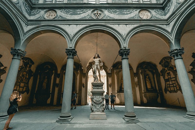 Travelers taking photos at a museum in Florence, Italy