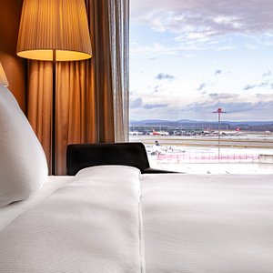 Radisson Blu Hotel, Zurich Airport in Kloten, image may contain: Table Lamp, Furniture, Cushion, Bedroom