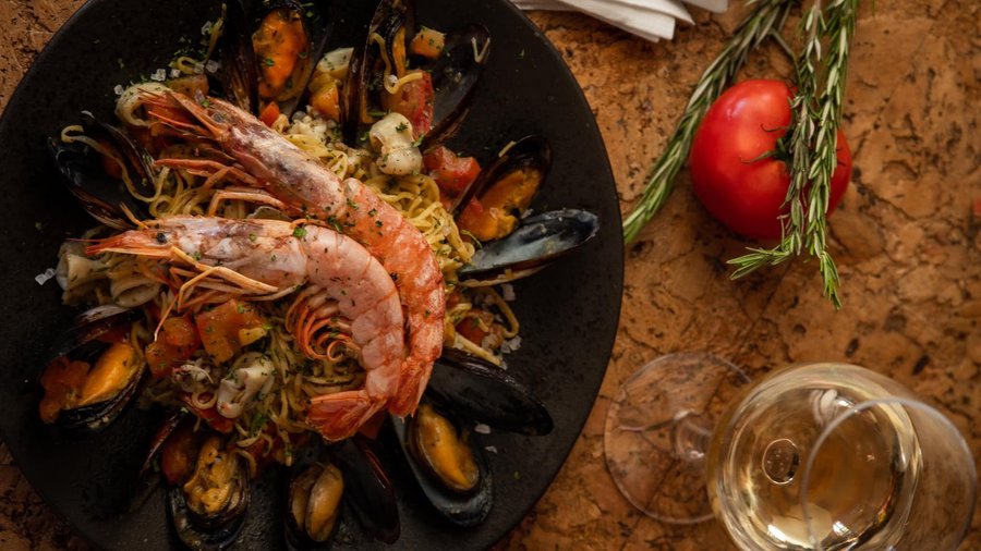 Another must at our restaurant: TAGLIOLINI ALLO SCOGLIO

Sea food pasta (fresh west coast Mussels, Prawns & Calamari) cooked in white white sauce.