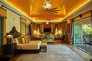Coorg Wilderness Resort & Spa in Madikeri, image may contain: Couch, Home Decor, Living Room, Chandelier