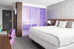 Royal Regency Hotel in Yonkers, image may contain: Furniture, Interior Design, Bed, Laptop