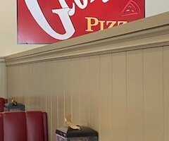 The sign in the dining room.
