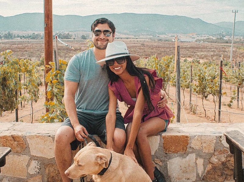 a couple in Mexico at a wine Vineyard