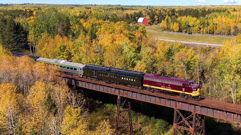 The North Shore Scenic Railroad on a bridge in autumn 