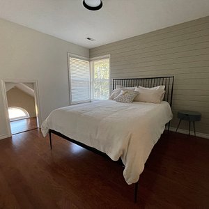 The Garden Room is bedroom 2 of 4. It has a queen size bed with luxurious linens. The room has east facing windows with a forest and farm land view. This bedroom shares a Jack and Jill bathroom with the Heron Room.