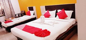 Hotel Ranjit Residency in Hyderabad, image may contain: Bed, Furniture, Cushion, Hotel