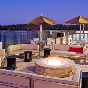 Outside patio and fire pit overlooking a beautiful lake