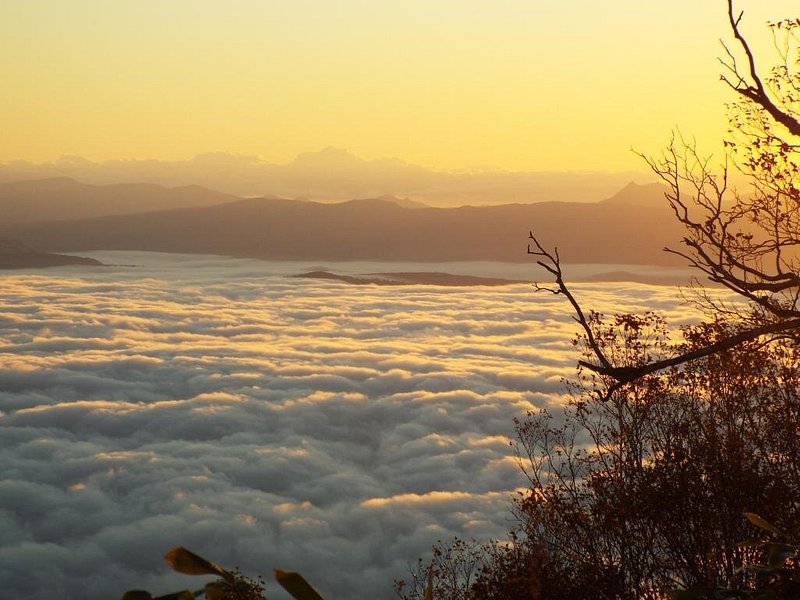 Sun setting above the clouds of the mountain