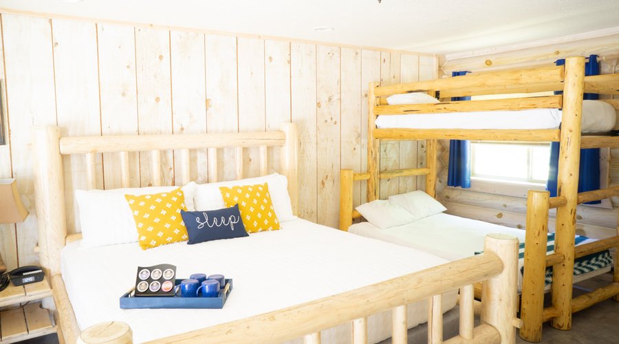 Family Room with one king bed and a full bottom bunk and twin top bunk. 