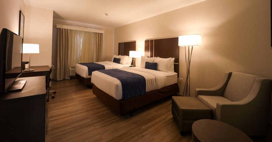 Double queen room featuring:
 Premium bedding
 Cable TV with premium movie channels
 Microwave
 Mini Fridge
 Coffee Maker with Choice coffee and tea
 Ice Bucket
 Electronic Safe
 Luggage Rack