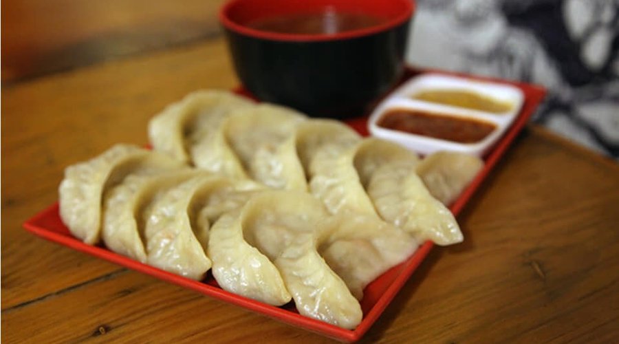 Steam momo ( Veg with Cheese - Rs. 185/- and Chicken/ Pork/ Buff- Rs. 210/-); 10 momo per serving