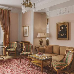 Grand Hotel Europe in St. Petersburg, image may contain: Home Decor, Chair, Table, Couch