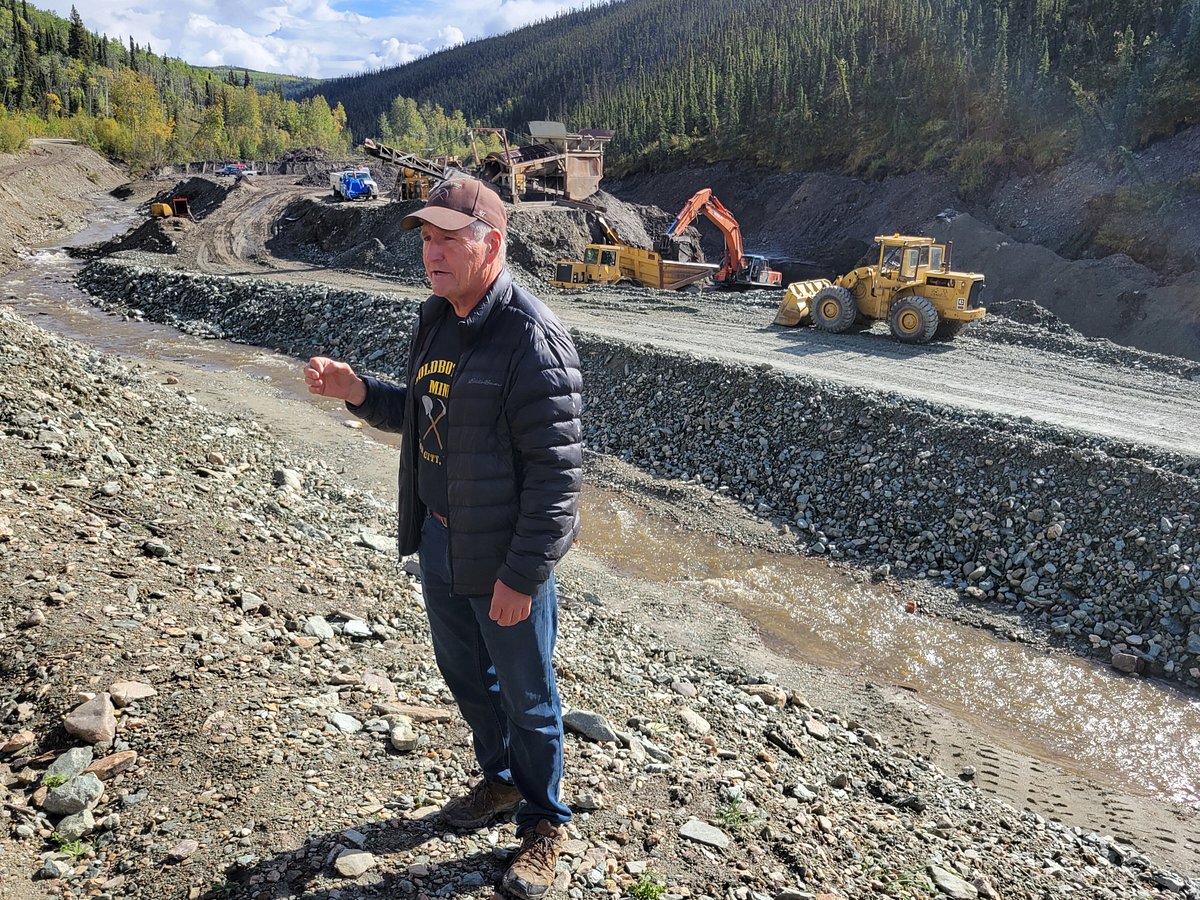 Gold Digger Shows Tourists Alluvial Gold Sand Mined In The Mine On