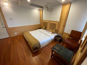 Hotel Sadaf in Srinagar, image may contain: Interior Design, Flooring, Floor, Wood