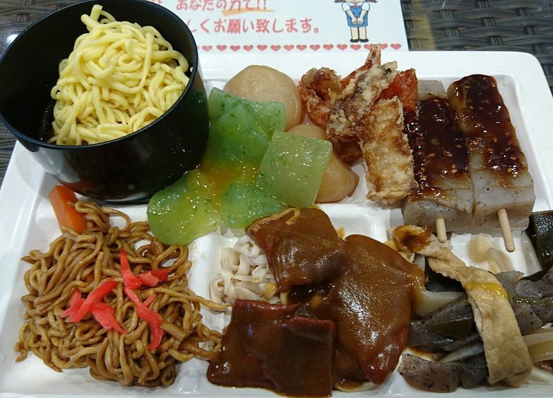 A set meal of Japanese food including soba noodles and vegetables