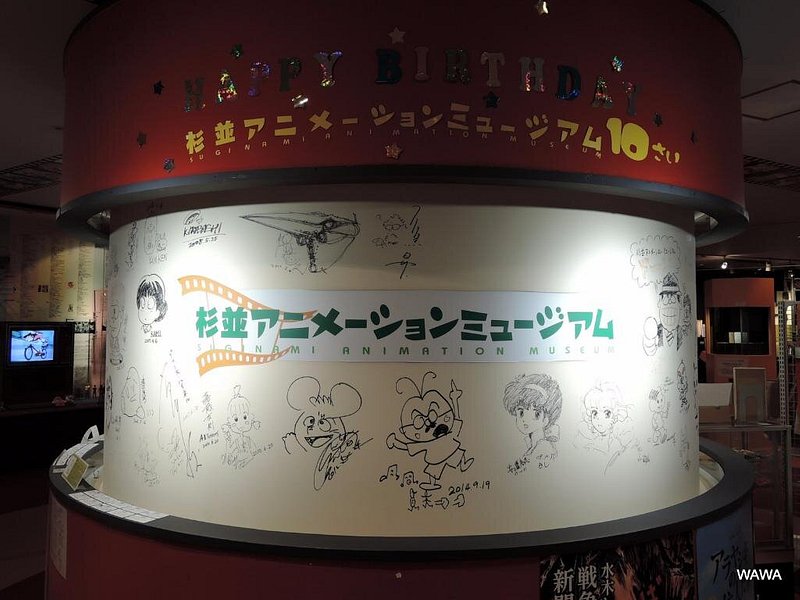 A wall filled with drawings